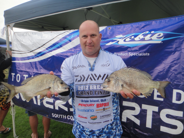 Chris Cleaver with his recently caught and released hybrid cod he likes to call a Murrout (cross between a Murray and trout cod).